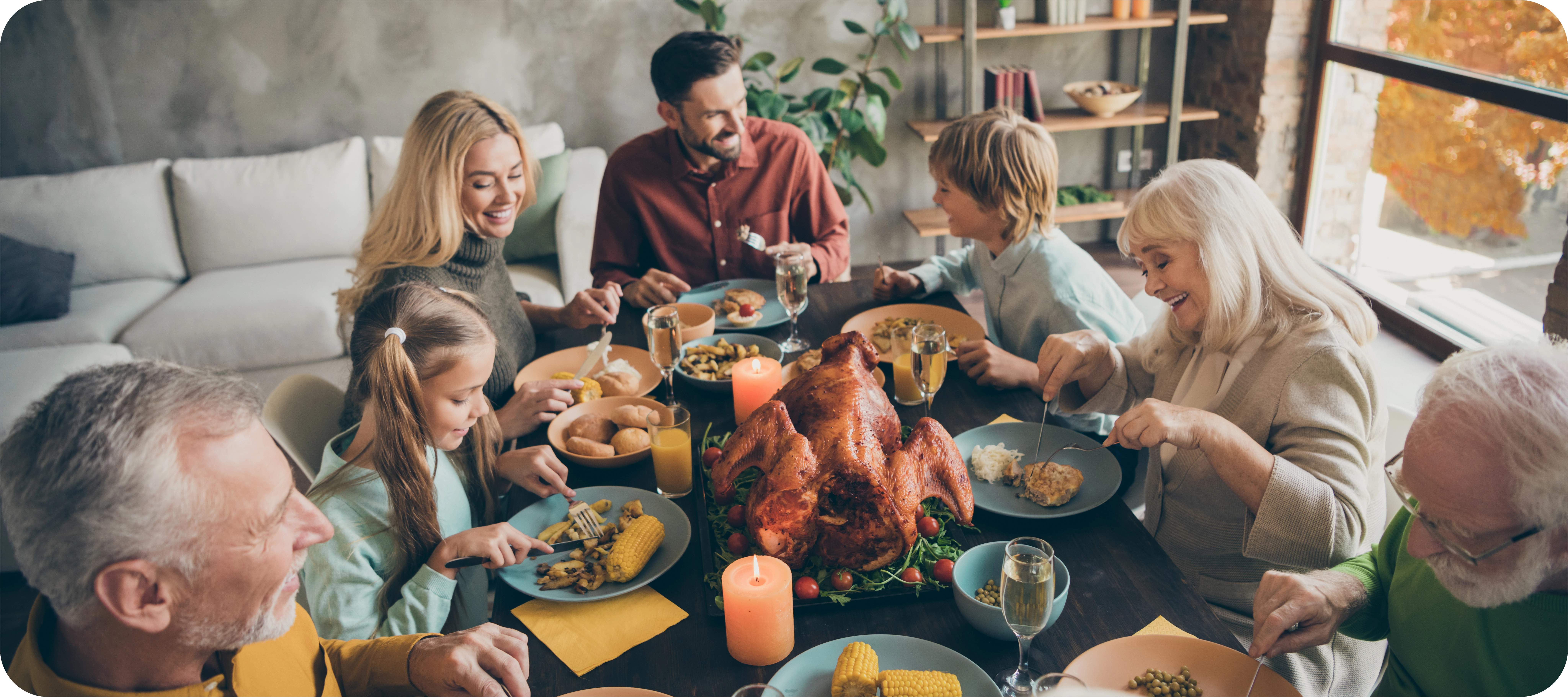 family enjoying dinner and happy to discuss their great credit scores